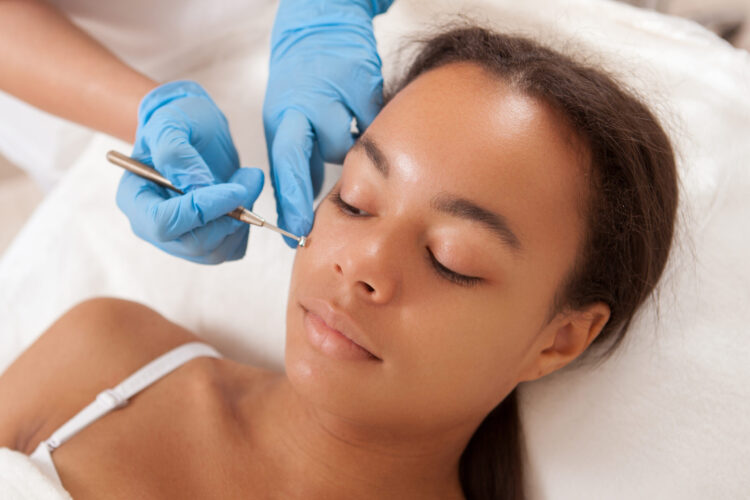 woman getting skin rejuvenation at dermatology office